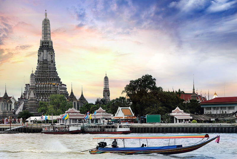 Wat Arun temple beside the Chao Phraya River in Bangkok