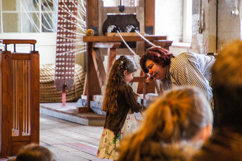 child learning about ropemaking inside the ropery at the historic dockyard chatham