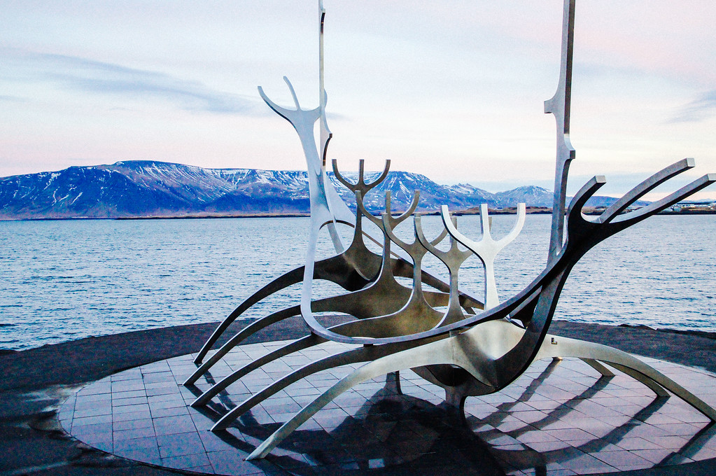 Close up of metal sculpture of a viking ship on Tjörnin Pond in Iceland