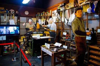 Workshop display with character figures at the Tora-san Museum