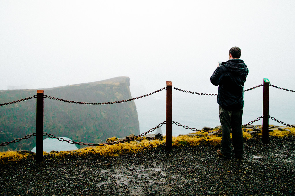 Gary photographing Dyrhólaey's arched rock