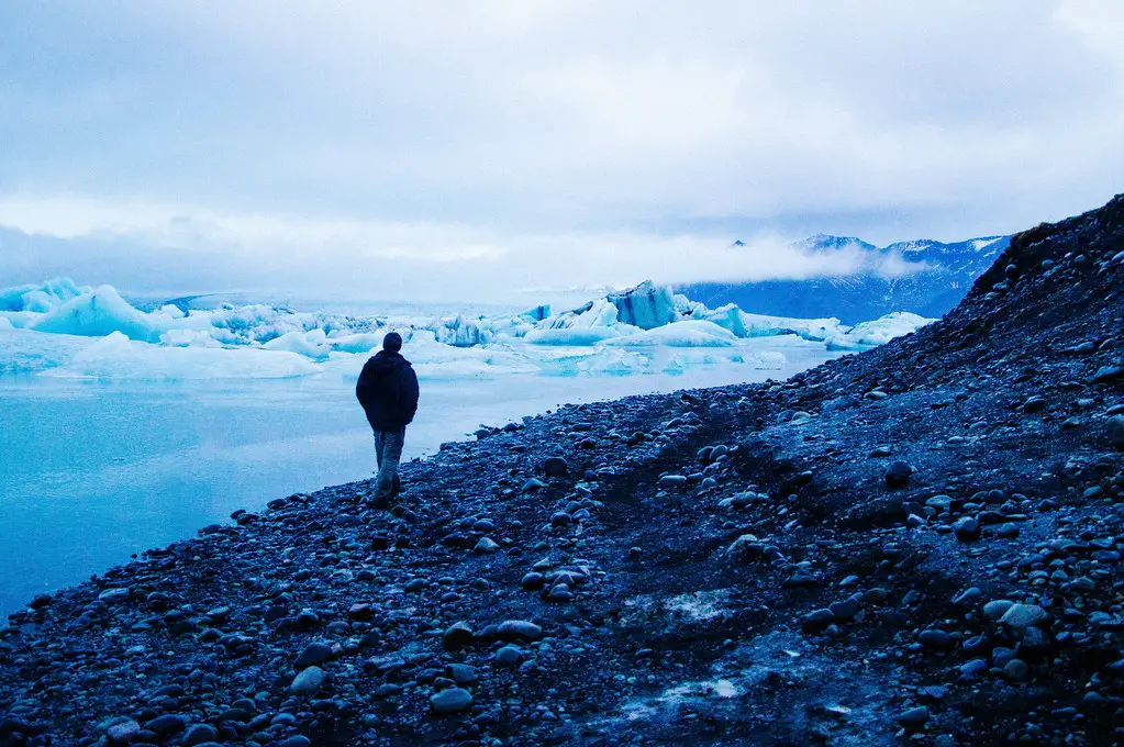 husband walking along Jokulsarlon Glacier Lagoon