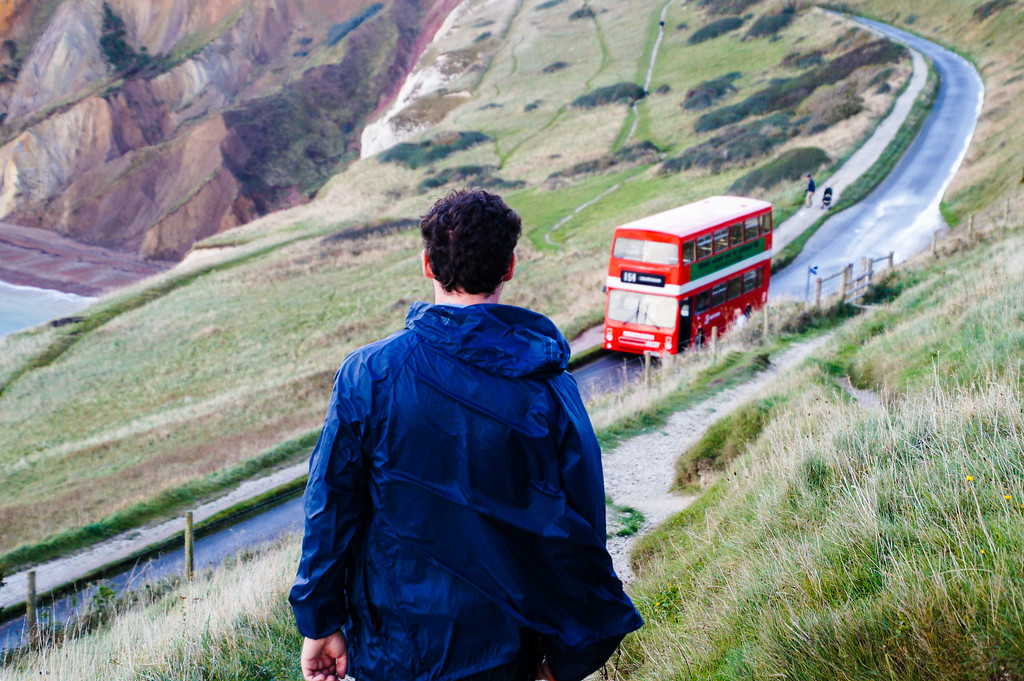 husband walking towards red bus at the needles on the isle of wight Gary walking towards the bus at The Needles