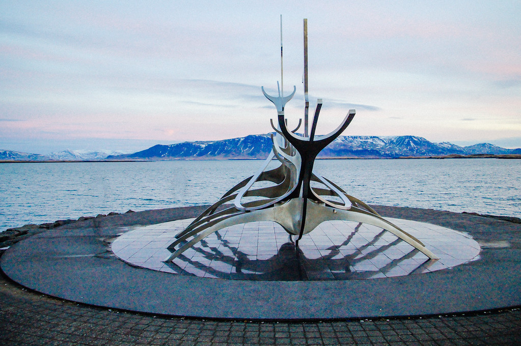 Metal sculpture of a viking ship on Tjörnin Pond in Iceland