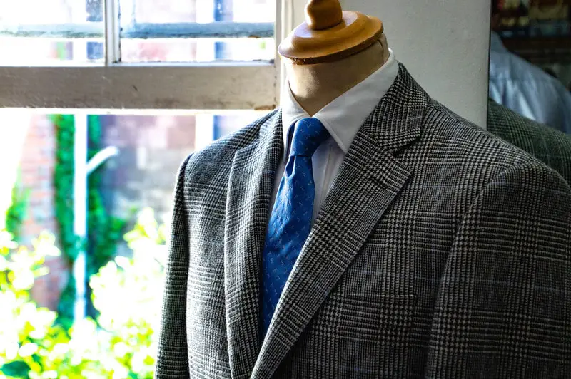 regent tailoring salisbury chequered suit with blue tie