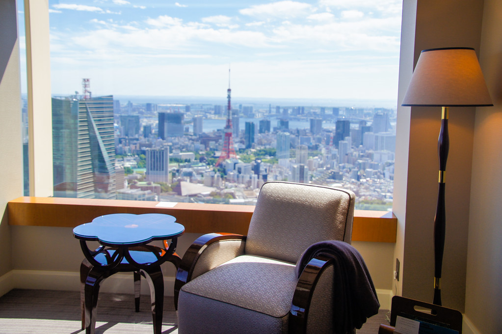 Tokyo Tower on the skyline beyond the living-room window of a Ritz-Carlton Tokyo suite
