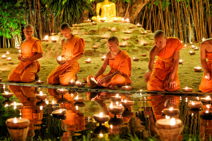 Buddhist monks praying for the Loy Krathong festival at Wat Phan Tao
