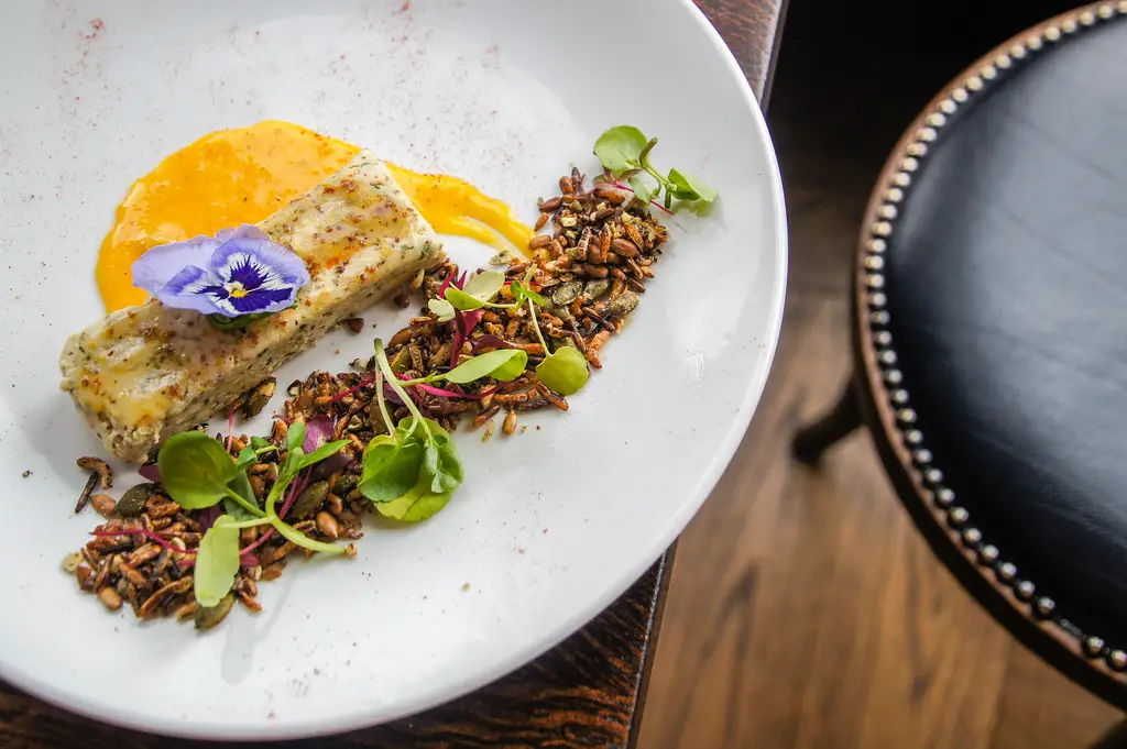 Chicken Terrine with confit yolk and savoury granola at Fire Stables wimbledon london Chicken Terrine with confit yolk and savoury granola at Fire Stables wimbledon london