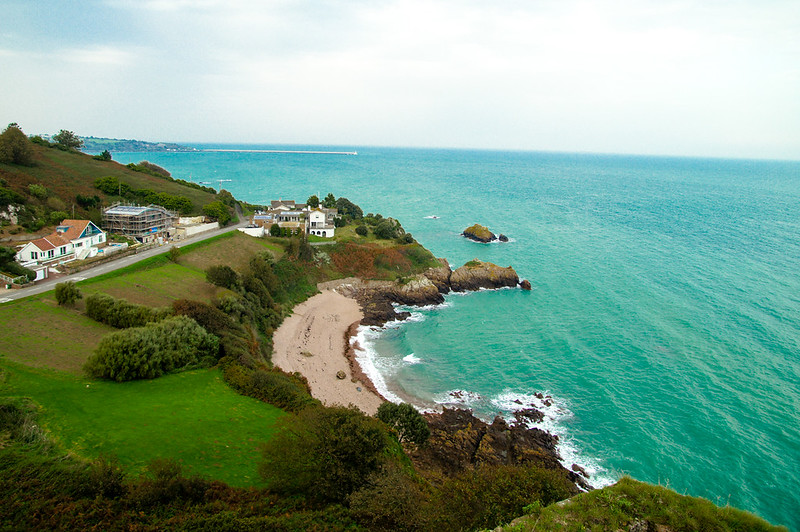 Rocky Jersey coastline and blue sea