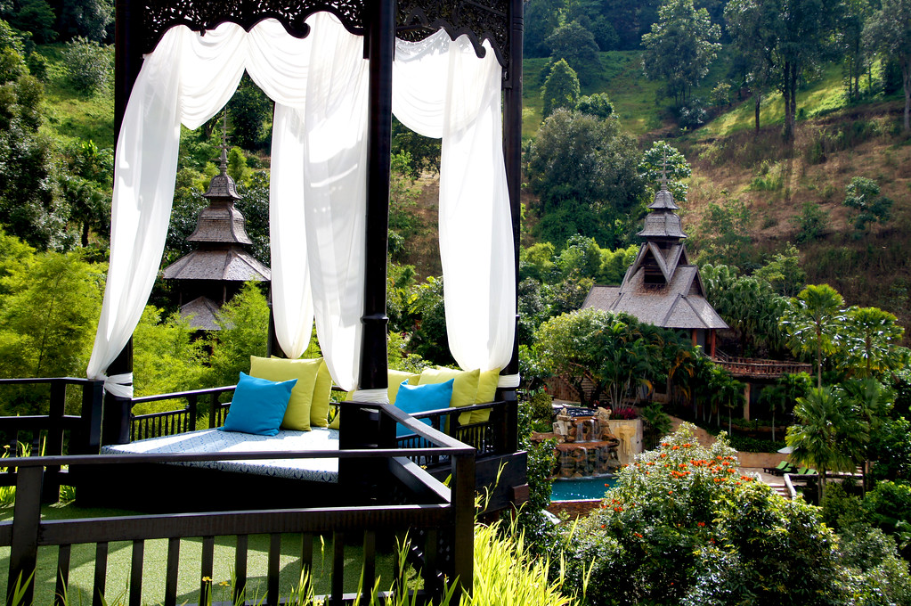 bed on terrace of main building of panviman chiang mai in thailand Bed on terrace of the main building at Panviman Chiang Mai Spa Resort