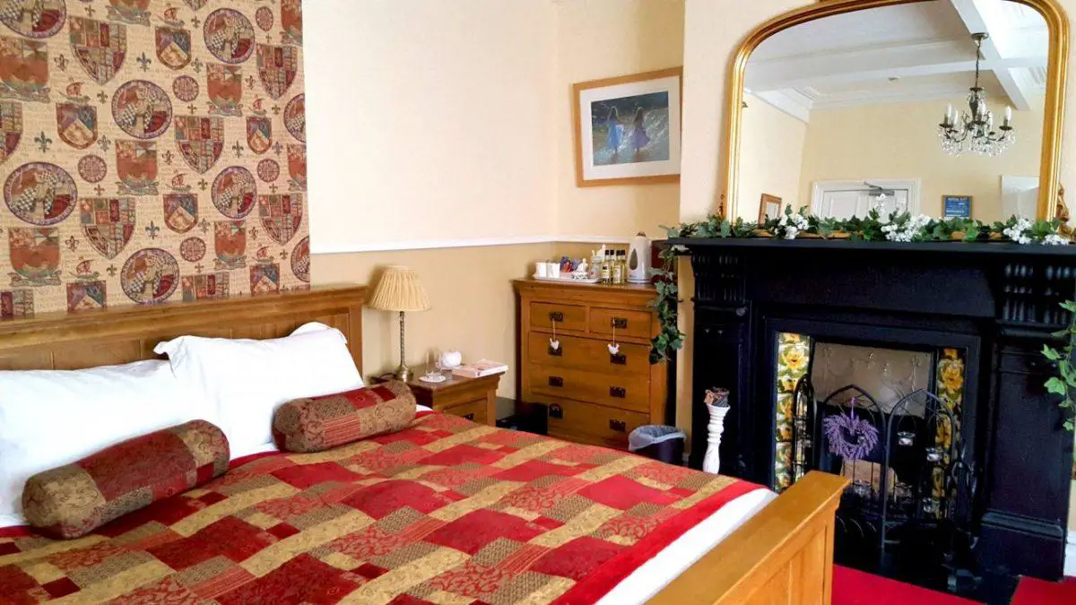 bedroom with fireplace of victoria bed and breakfast in caernarfon in snowdonia wales