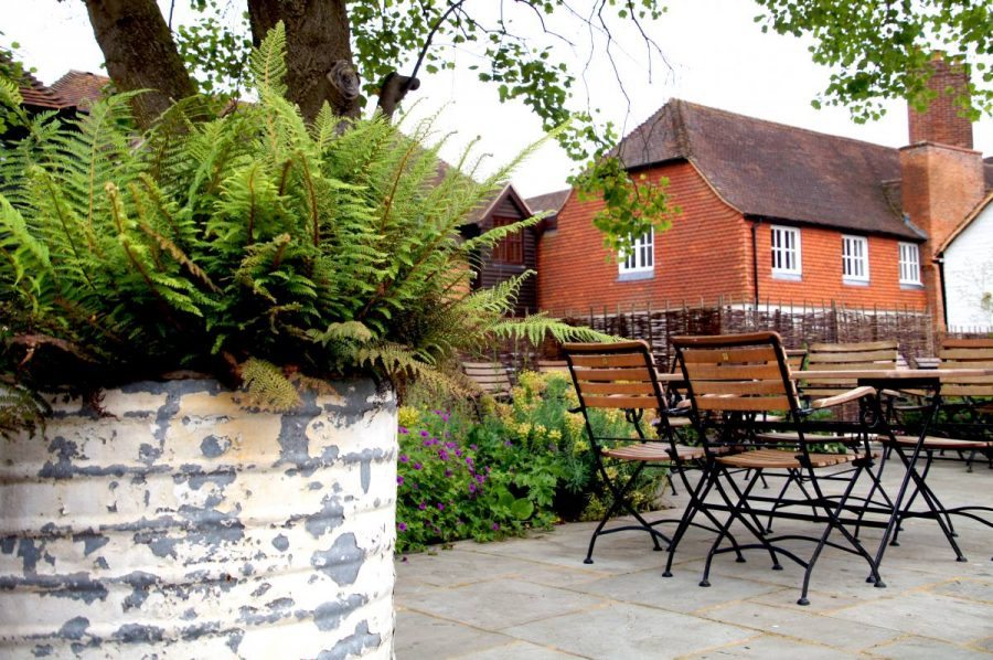 big plant pot with ferns on the terrace of the bel and dragon in odiham