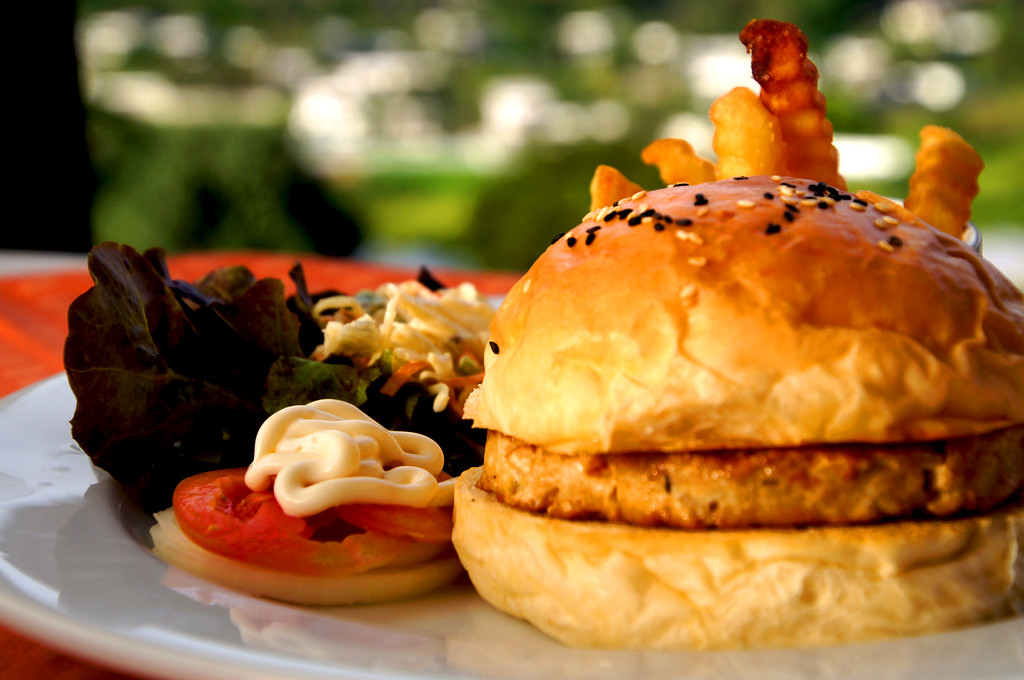 burger for dinner in restaurant of of main building of panviman chiang mai in thailand Burger for dinner in restaurant of the main building at Panviman Chiang Mai Spa Resort