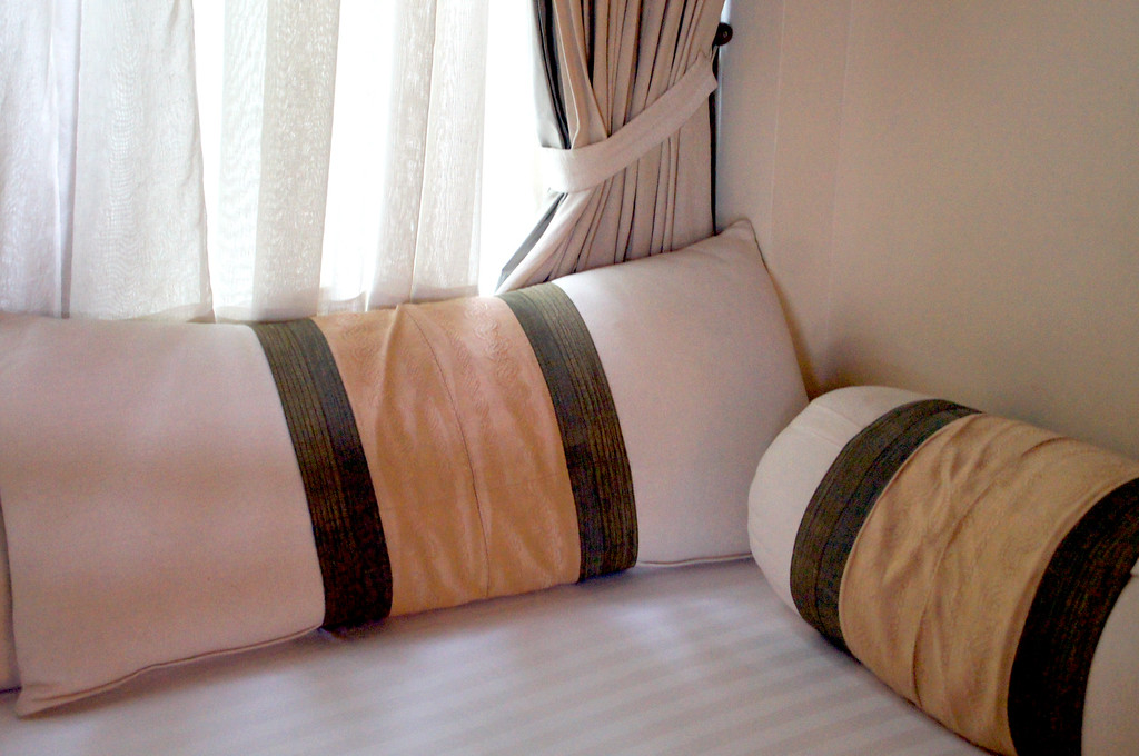 cushions on lounge chair in bedroom in private villa at panviman chiang mai in thailand Cushions on lounge chair in bedroom in a private villa at Panviman Chiang Mai Spa Resort
