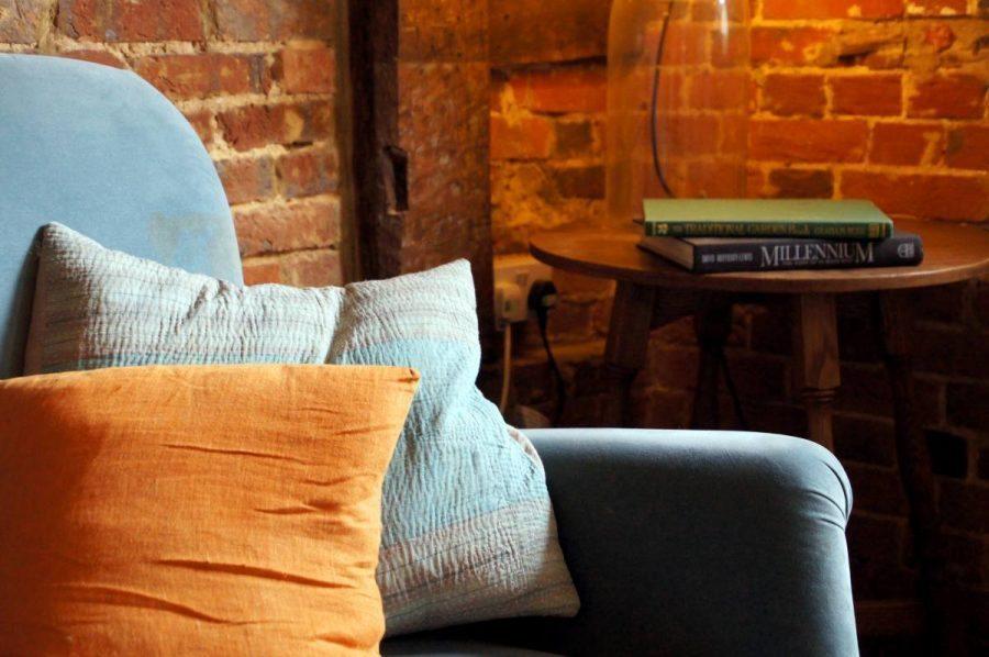 cushions on sofa in resident only drawing room at the bel and dragon in odiham