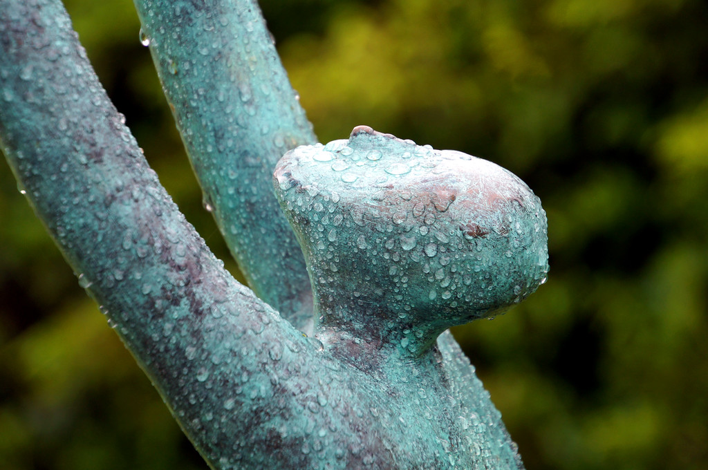 dancing statue with water droplets in borde hill garden Dancing statue with water droplets in Borde Hill Garden