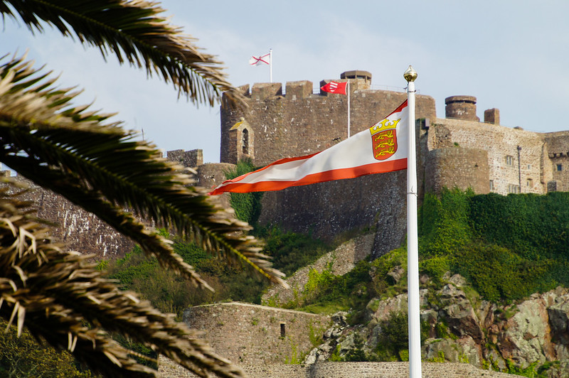 Flag in front of Mont Orgueil Castle in Jersey