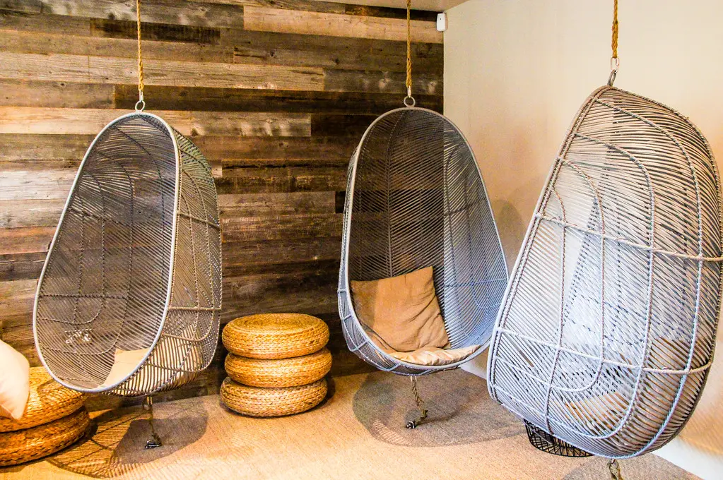 hanging chairs in the members lounge at Bhuti Vegan restaurant in richmond london