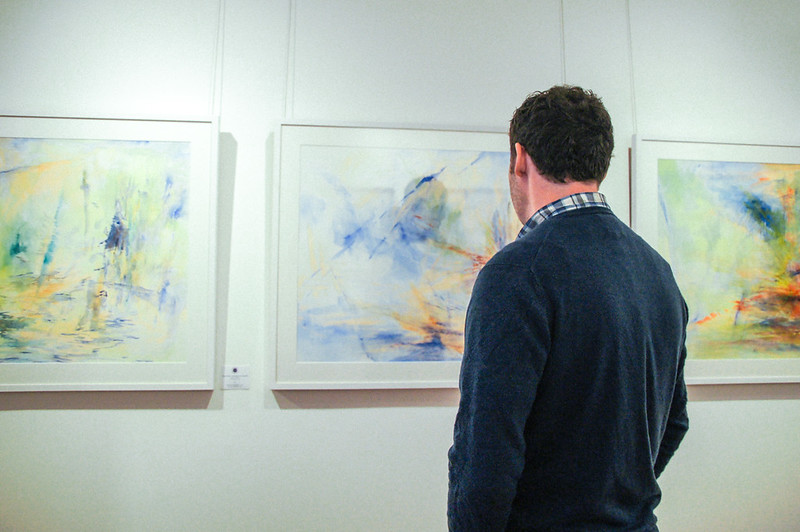 Gary looking at paintings in CCA art gallery in Jersey