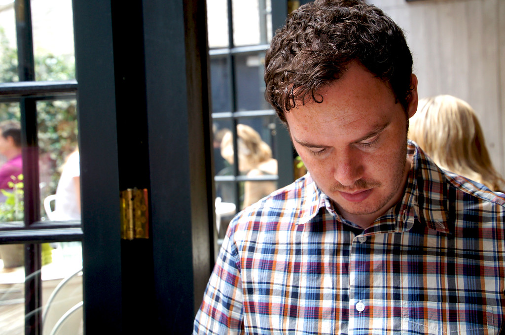 husband sitting in outdoor terrace of no1 duke street richmond london