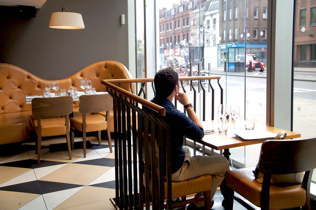 husband sitting in rocket italian fusion restaurant in london husband sitting in rocket italian fusion restaurant in london