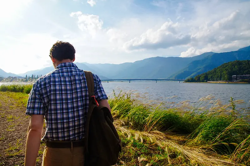 husband walking around lake kawaguchiko near Tokyo in Japan