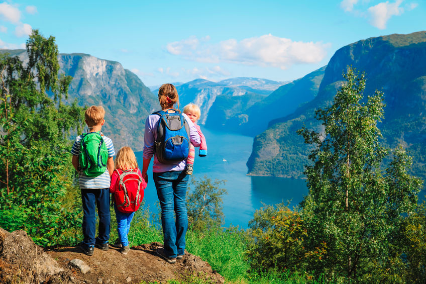 mother with kids travel hiking in nature Norway