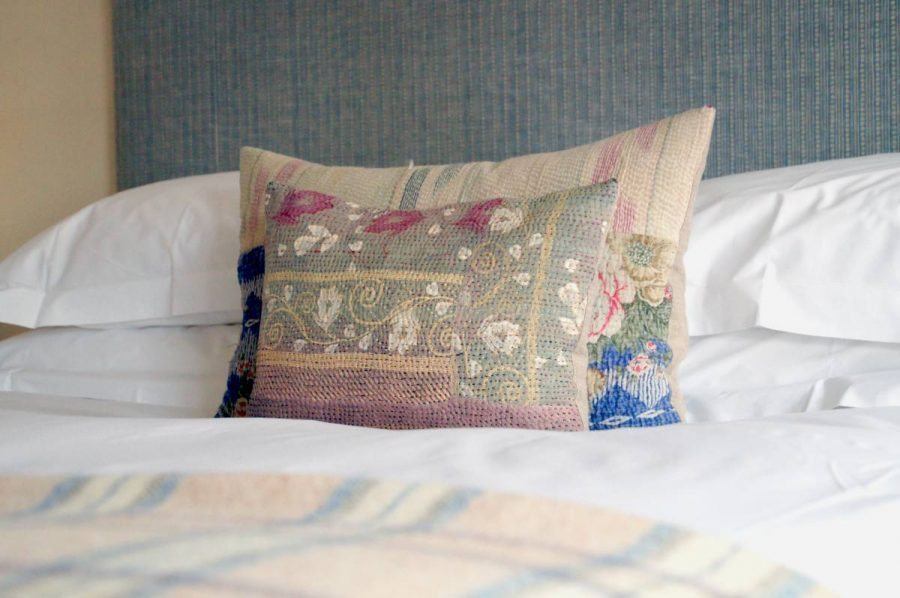 patterned cushions on the bed in the premium double en suite room the Damson at the bel and dragon in odiham