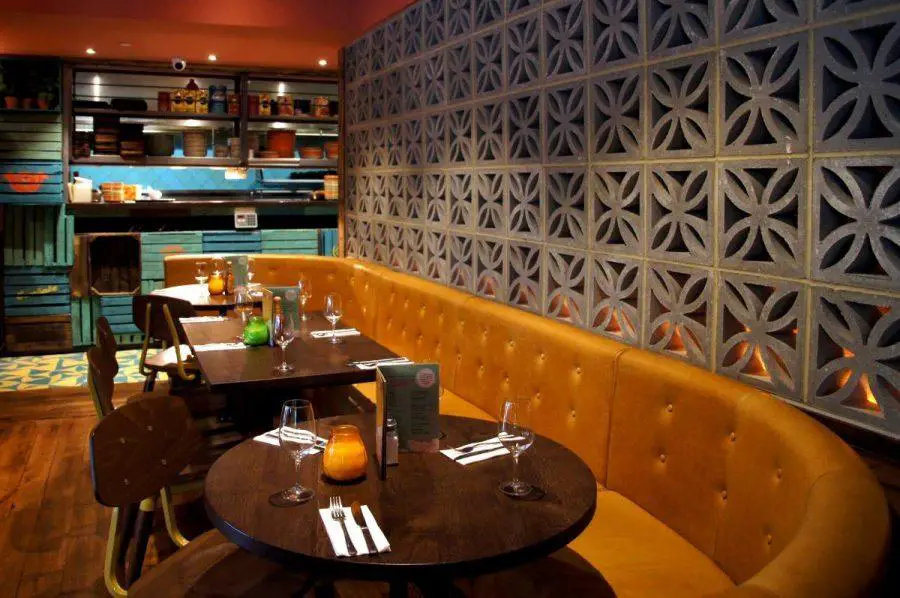 sofa seating and tables at las iguanas latin american restaurant on brunswick square in London
