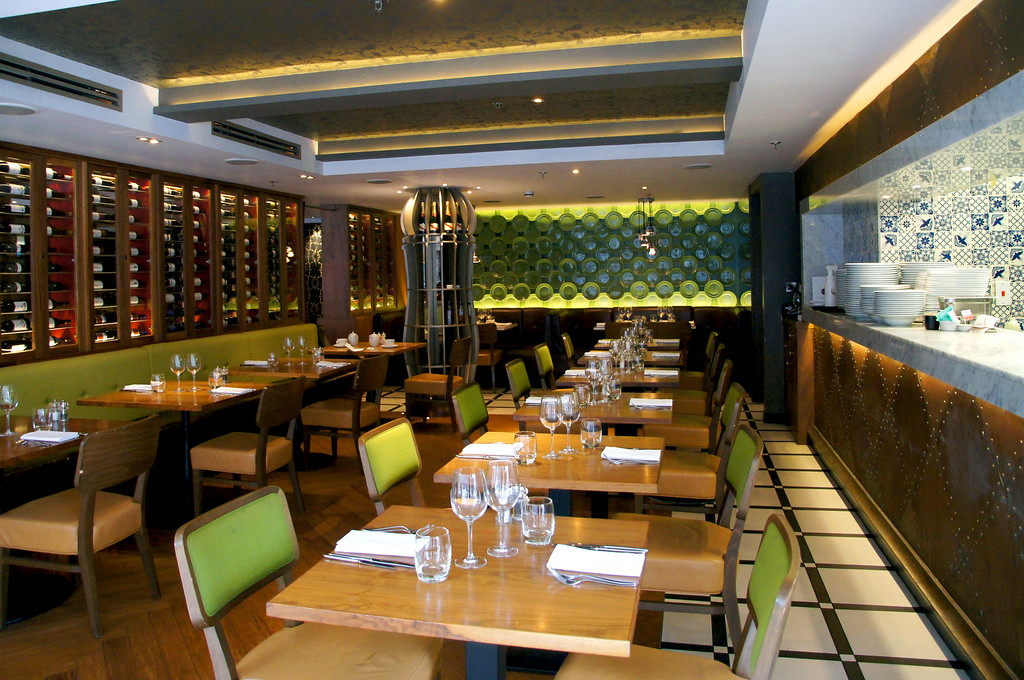 table and green chairs in rocket italian fusion restaurant in london table and green chairs in rocket italian fusion restaurant in london