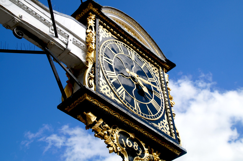 town clock hanging from the guildhall in guildford