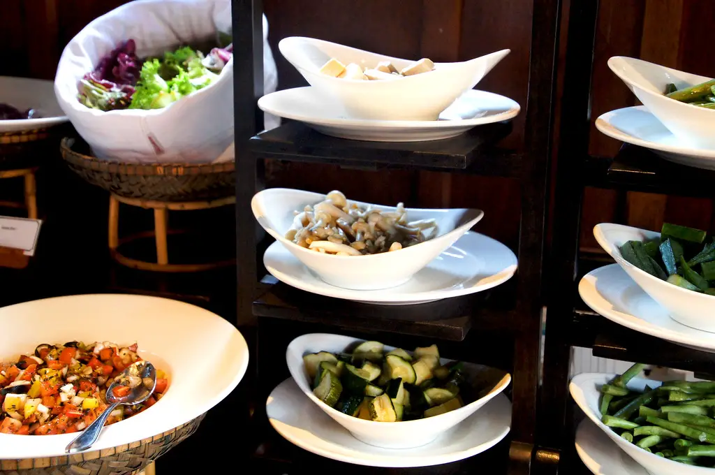 vegetable dishes on breakfast bar at 137 pillars house in chiang mai thailand