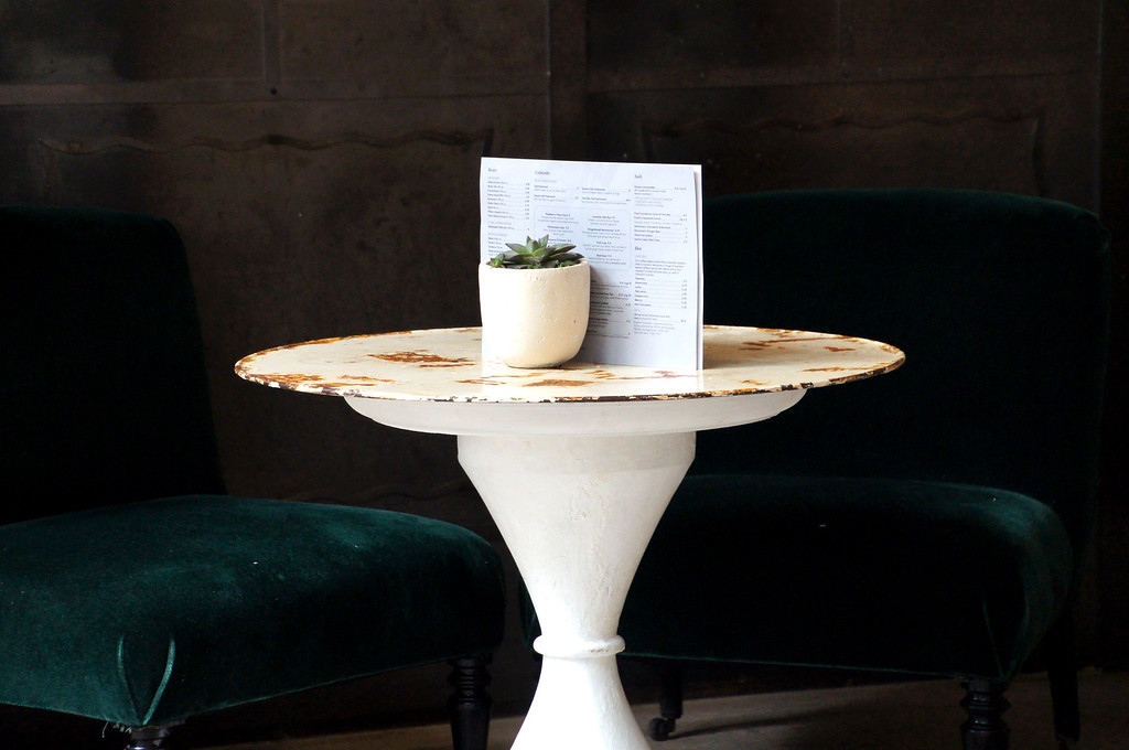 velvet chairs and white table in outdoor terrace of no1 duke street richmond london