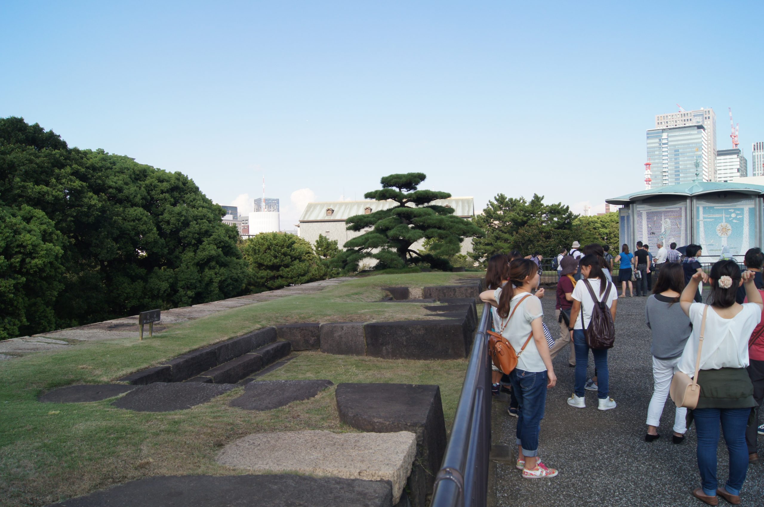 DSC05230 scaled Visitors walk beside the broad stone foundations of the former Edo Castle keep.