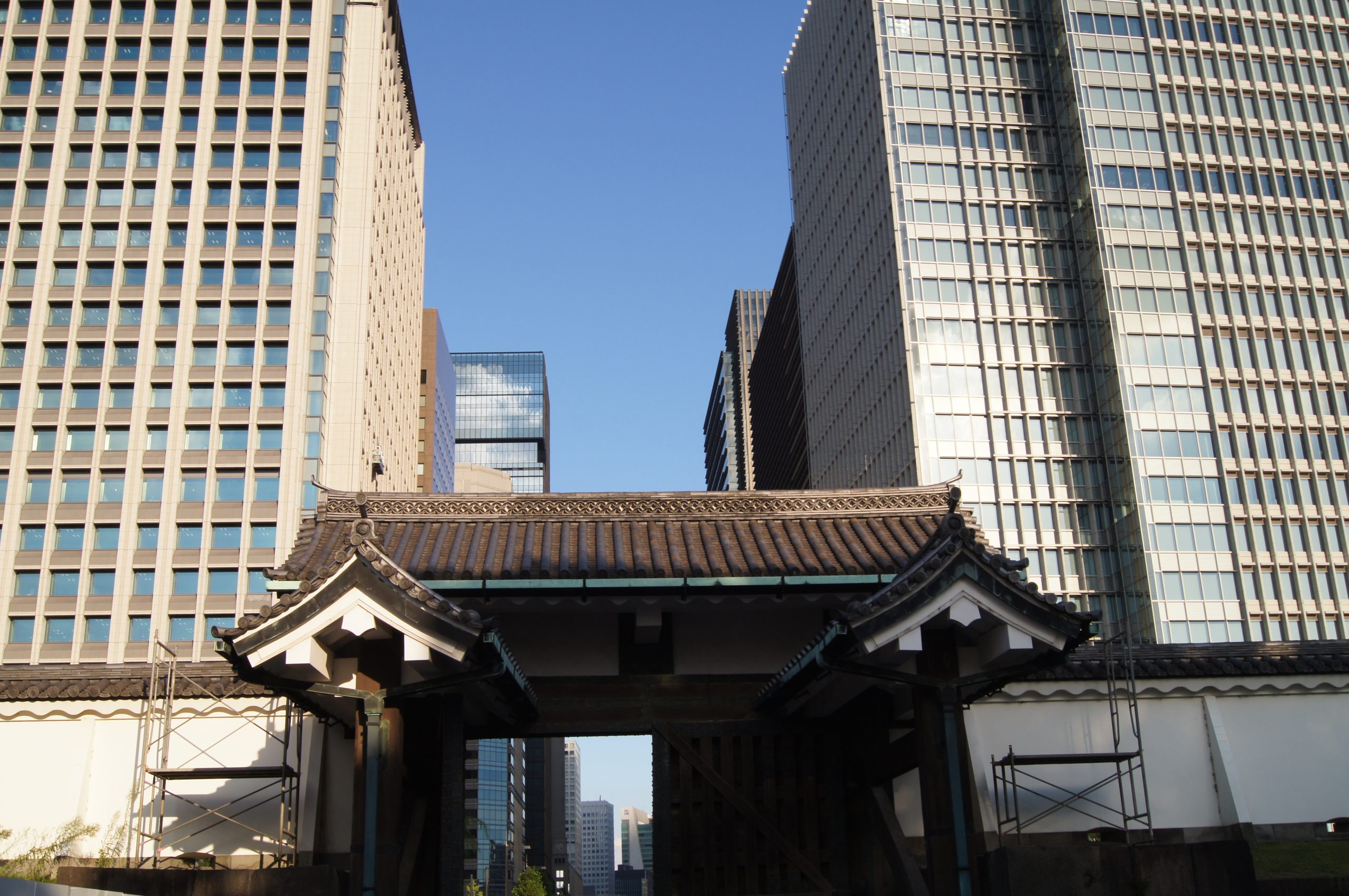 The traditional Otemon Gate stands between modern Marunouchi towers at the Tokyo Imperial Palace.