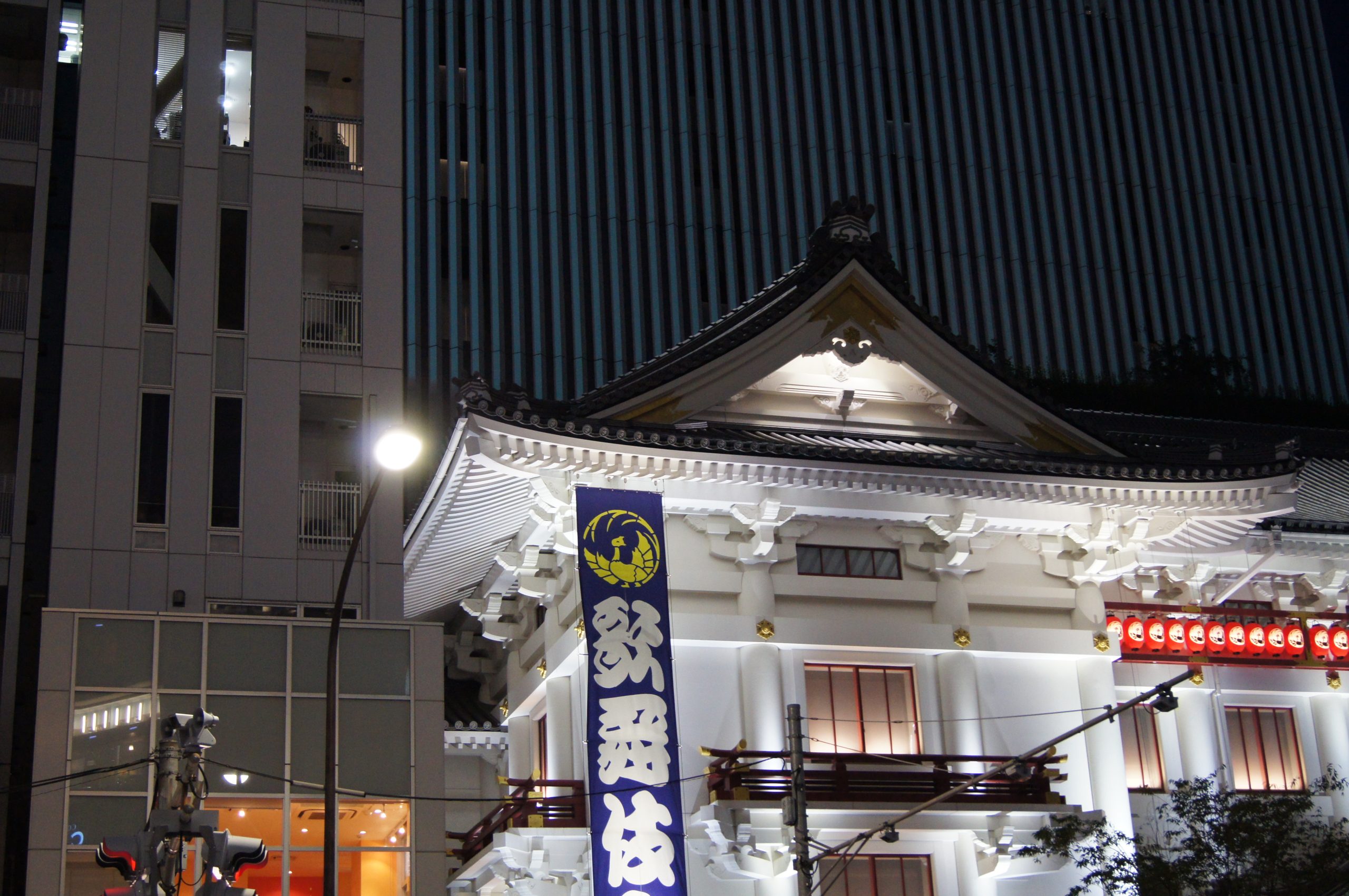 DSC05294 scaled The ornate white facade of Kabukiza Theatre is illuminated at night in Ginza, Tokyo.