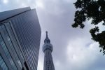 Tokyo Skytree rising beside Tokyo Solamachi under a cloudy sky