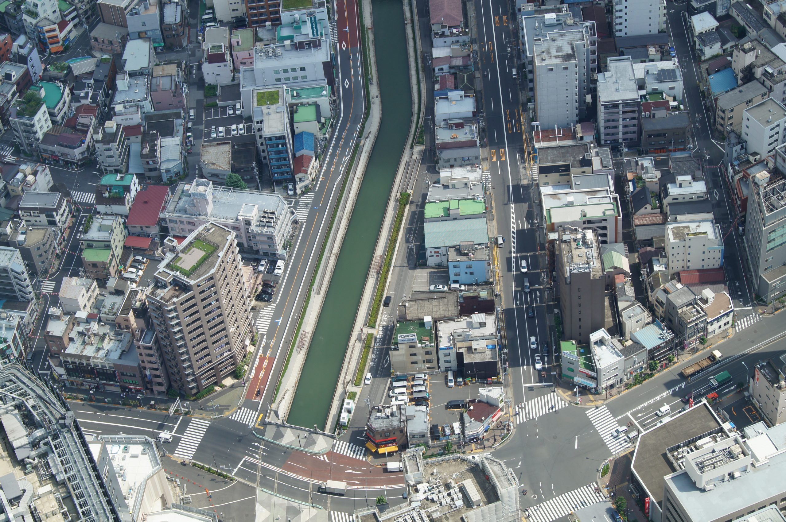 Streets, rooftops and a canal seen almost straight down from Tokyo Skytree