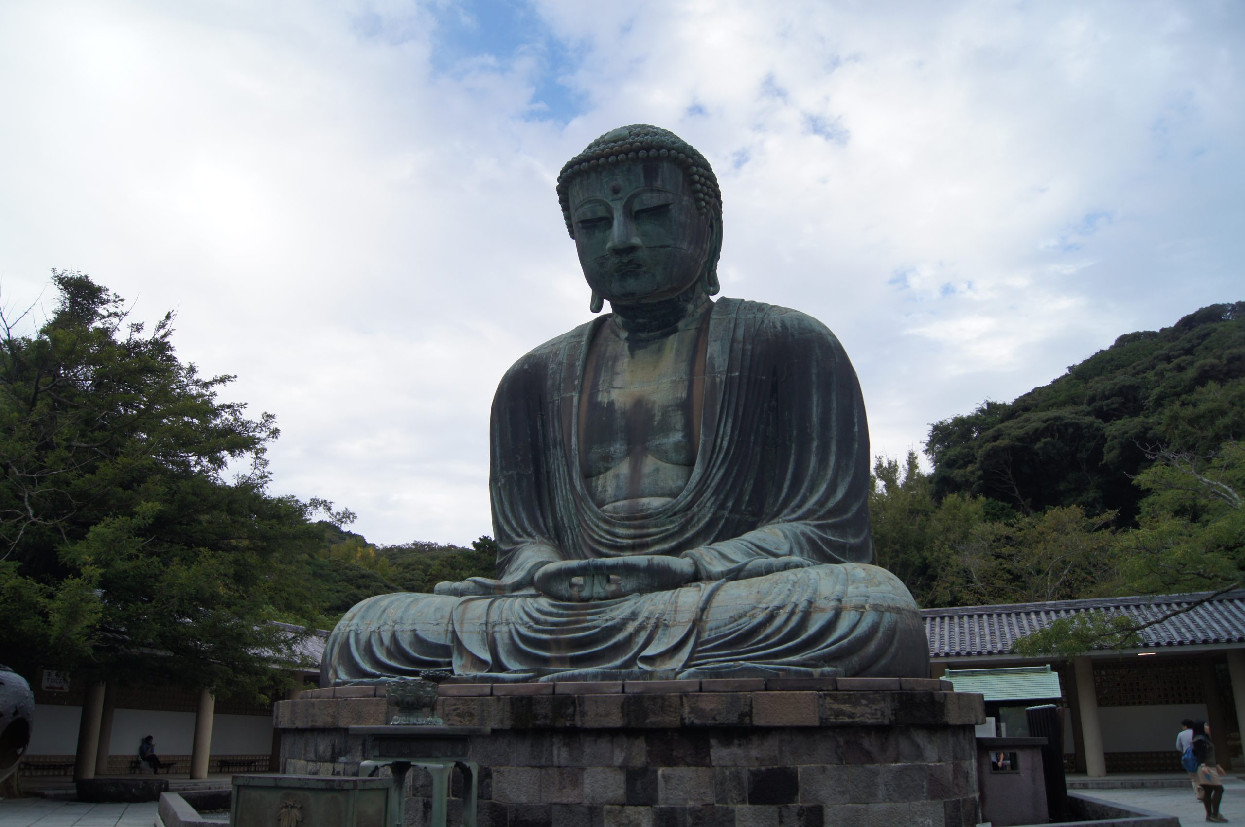 The monumental bronze Great Buddha sits on its stone base at Kotoku-in temple.
