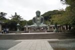 The seated bronze Great Buddha is viewed from the central stone path at Kotoku-in.