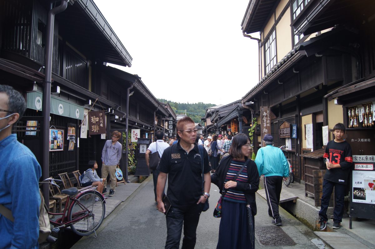 DSC06152 A busy traditional street lined with wooden buildings and shops in Takayama.