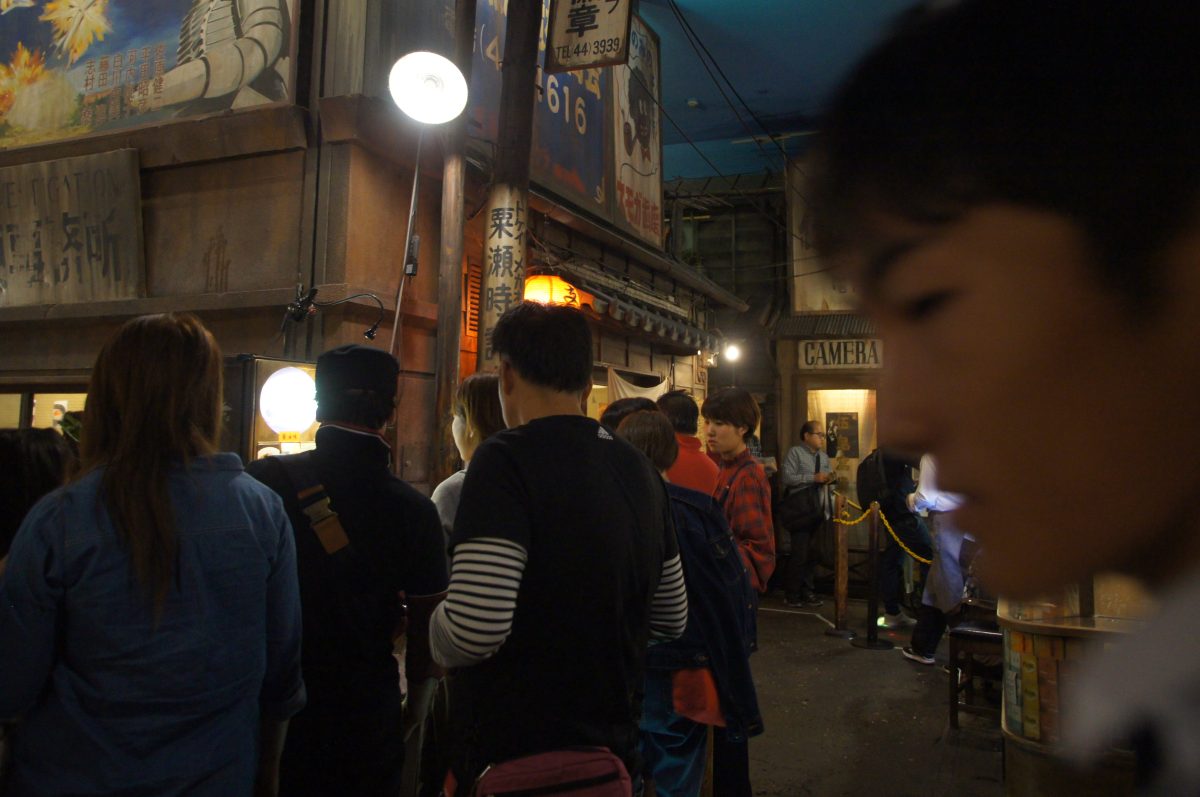 Visitors walking through the recreated 1958 streetscape at Shin-Yokohama Ramen Museum
