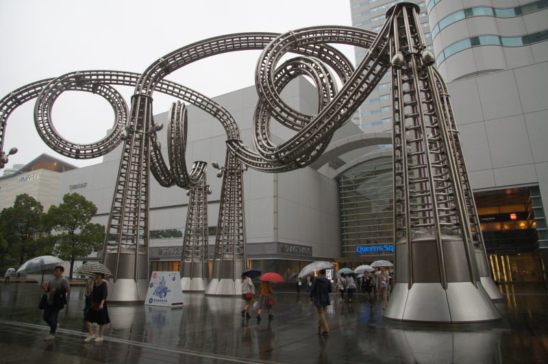 DSC07364 Looping roller coaster track beside modern buildings in Yokohama