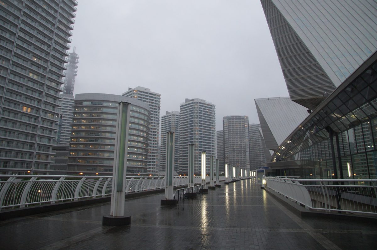 DSC07383 Modern Yokohama buildings seen beside a wet road in heavy rain