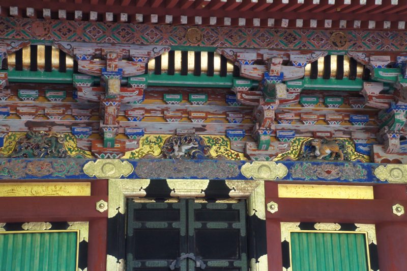 DSC07482 Painted carvings on the Sacred Storehouse at Nikko Toshogu Shrine