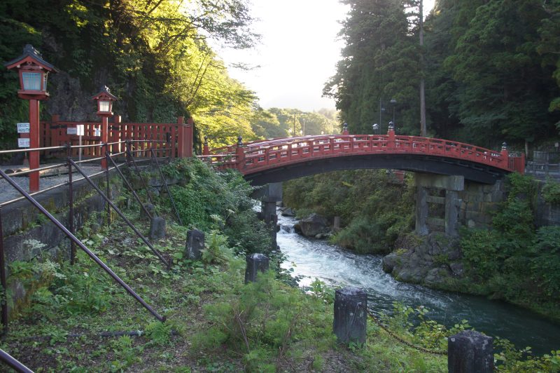 DSC07764 Red Shinkyo Bridge seen through green trees in Nikko