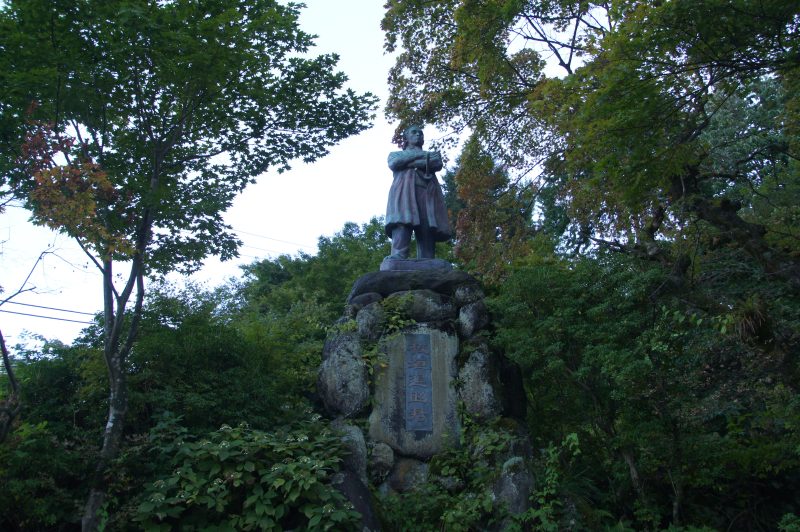 DSC07768 Stone statue among trees near Shinkyo Bridge in Nikko