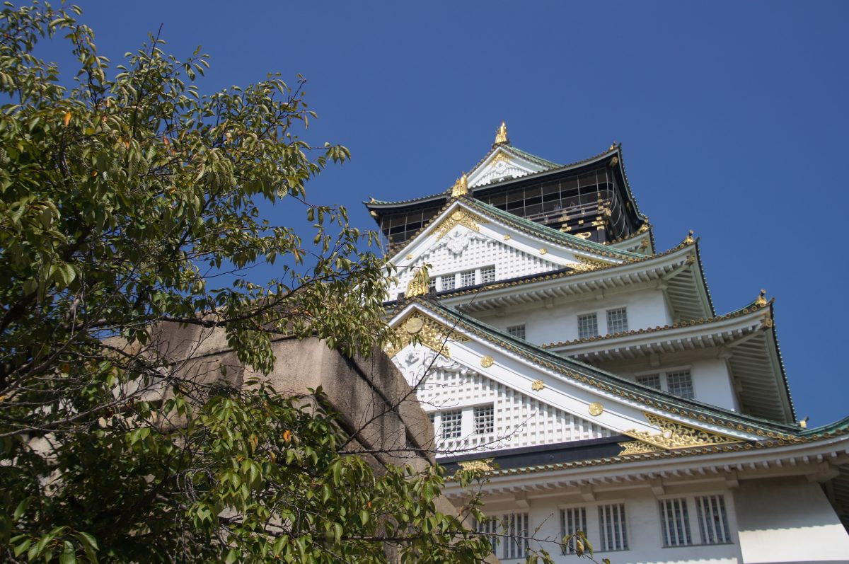 DSC09432 2 Osaka Castle rising beyond the moat, trees and stone ramparts