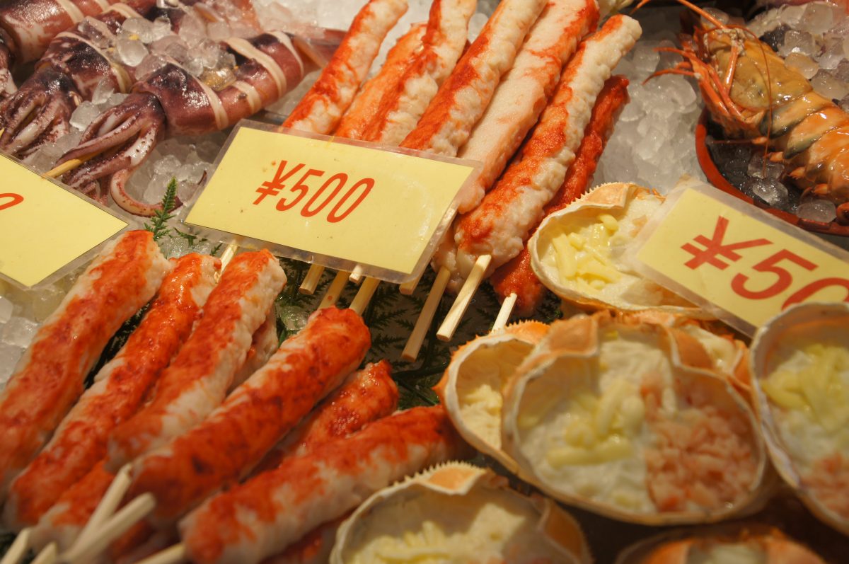 Crab legs and seafood on ice at Kuromon Ichiba Market in Osaka