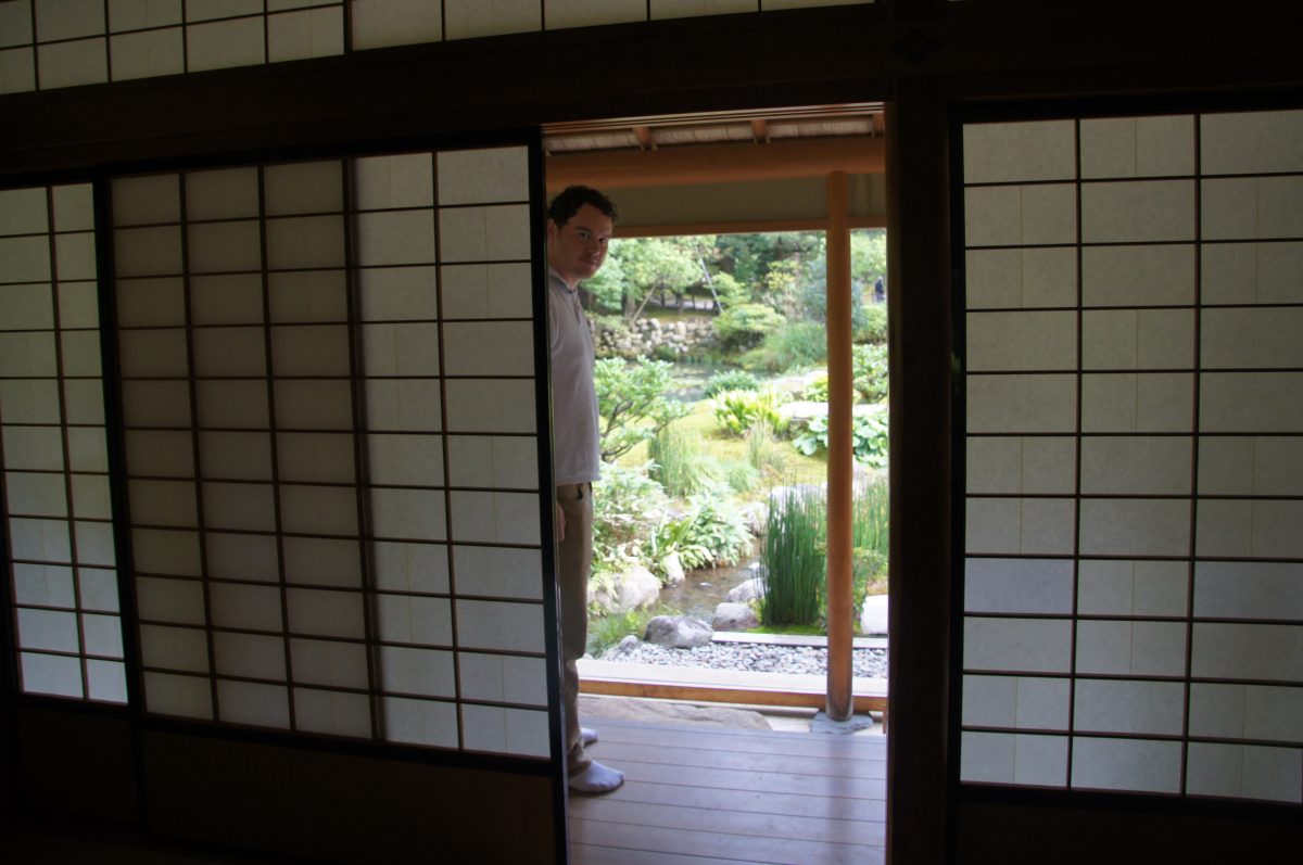Gary standing in the Shigure-tei tea room beside its garden